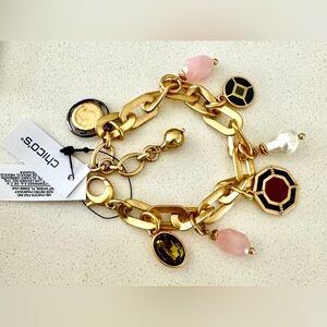 Chico’s bracelet Golden with 7 charms securely locked- adjustable New With Tag